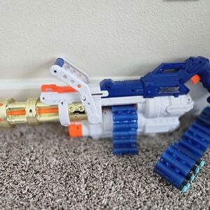 Nerf Machine Gun With Clip And Some Foam Bullets But Fits Most Others